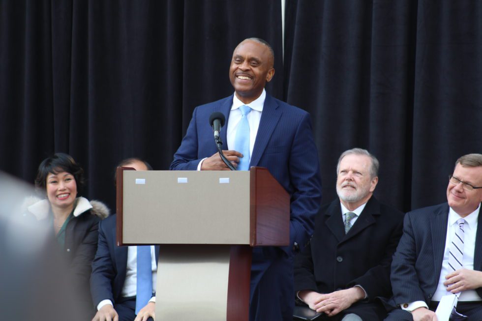 Photo of Representative Robert Reives smiling at podium