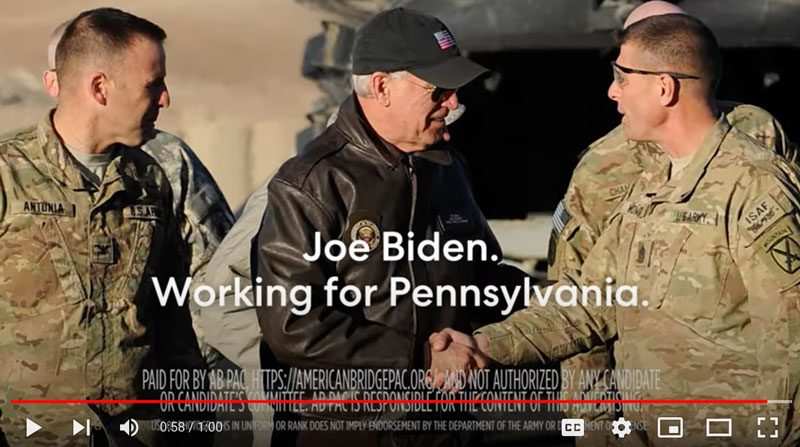 Picture of Joe Biden shaking hands with military members. Captioned "Joe Biden. Working for Pennsylvania"